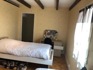 Postel nebo postele na pokoji v ubytování Chez Lysette + 6 fotografií