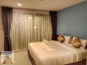 Louis' Runway View Hotel - SHA Extra Plus客房内的一张或多张床位
