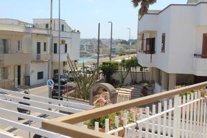 a view of a city from a balcony of a building at Il Gabbiano in Otranto