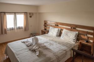 Ένα ή περισσότερα κρεβάτια σε δωμάτιο στο Blue Fox 