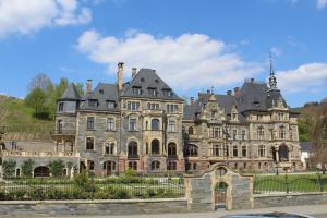 an old mansion in the middle of a street at Ferienhaus Milena in Lieser