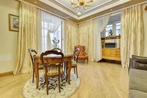 a dining room with a table and chairs at Luxury Pilies Avenue Apartment in Vilnius