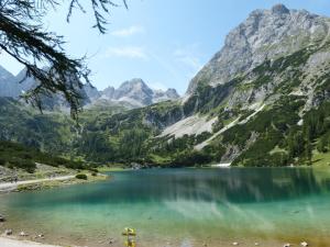 a view of a mountain lake in the mountains at Appartements Alpenland in Lermoos