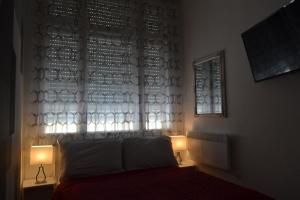 Posteľ alebo postele v izbe v ubytovaní City Corso Apartman