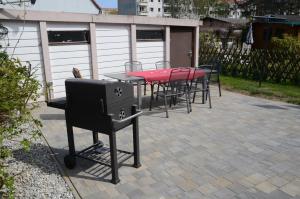 a group of tables and chairs on a patio at FH Hannahliese_WEND in Ostseebad Karlshagen