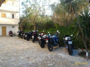motorcycles parked next to each other at Meta Hotel in Santa Teresa Gallura