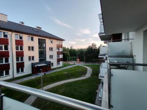 a view from the balcony of an apartment building at Mazurski Apartament in Mrągowo