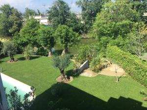 an aerial view of a garden with trees and grass at Villa Louise-Rose in Villeneuve-Loubet