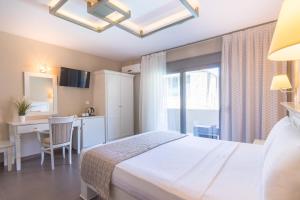 Ntinas Filoxenia Hotel & Spa客房内的一张或多张床位