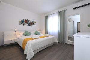 Postel nebo postele na pokoji v ubytování Holiday House Tamaris + 25 fotografií