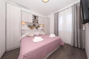 Postel nebo postele na pokoji v ubytování Holiday House Tamaris