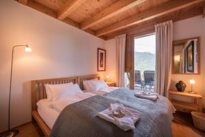 Postel nebo postele na pokoji v ubytování Chalet Roossi 2