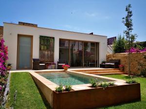 a house with a swimming pool in the yard at Can Liret in Palafrugell