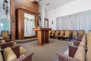 a lecture room with a podium and chairs at King David Residence Luxury 4 BD/Pool/Gym/Parking in Jerusalem