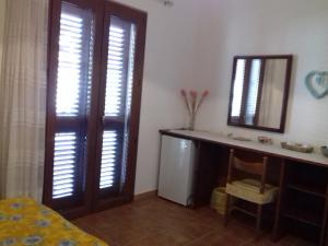 A bed or beds in a room at Canne Al Vento