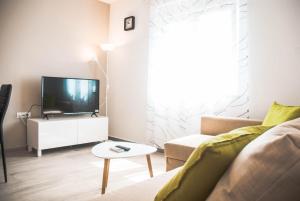 TV a/nebo společenská místnost v ubytování Tomi