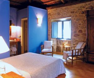 A bed or beds in a room at Casa do Castelo de Andrade