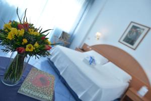 Łóżko lub łóżka w pokoju w obiekcie Hotel Pensione Reale