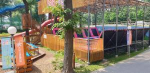 a playground with a slide in a park at Apartament Kustronia z Garażem in Bielsko-Biala