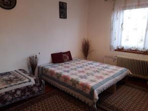 מיטה או מיטות בחדר ב-Ladislav