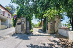 an empty street with a gate on the side of a building at Villa Eugenia in Livorno