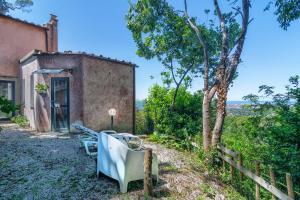 an old building with a chair in front of it at Villa Eugenia in Livorno