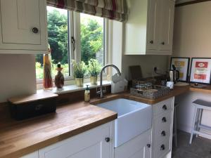 a kitchen with a sink and a window at The Old Barn 26 Church Street in Market Deeping