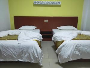 CHONG TI HOTEL客房内的一张或多张床位