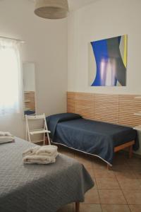 Stella del Sud Guesthouse tesisinde bir odada yatak veya yataklar