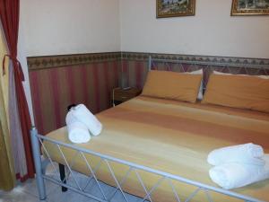 Ένα ή περισσότερα κρεβάτια σε δωμάτιο στο Astra