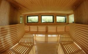 an empty sauna with two windows in the middle at Hotel Garni La Roccia in Andalo