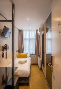a hotel room with a bed and a window at Cityview Hotel in Amsterdam +76 photos
