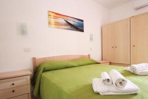 Postel nebo postele na pokoji v ubytování Residence Calavà