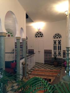 a hallway of a house with a white door at Dar Nakhla Naciria in Tangier