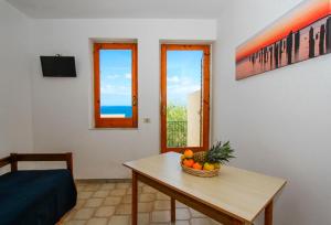 TV a/nebo společenská místnost v ubytování Residence Calavà