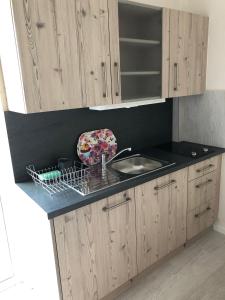 A kitchen or kitchenette at helios apartmenthouse