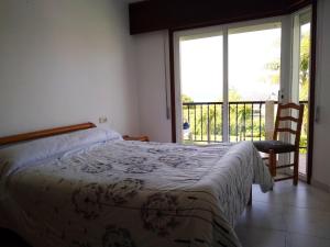 Postel nebo postele na pokoji v ubytování Apartamento fontiñas Sanxenxo montalvo + 37 fotografií