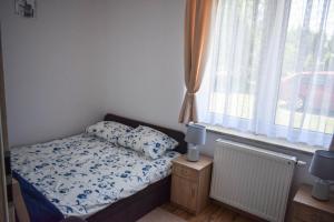 Postel nebo postele na pokoji v ubytování Megan
