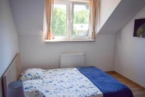 Postel nebo postele na pokoji v ubytování Megan