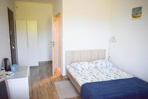 Postel nebo postele na pokoji v ubytování Megan