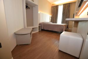 Posteľ alebo postele v izbe v ubytovaní Hotel Enrichetta