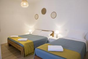 A bed or beds in a room at Albergo Mio Boutique Hotel
