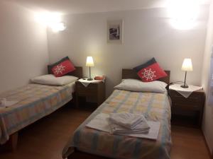 Postel nebo postele na pokoji v ubytování Apartments Jadranka Povile