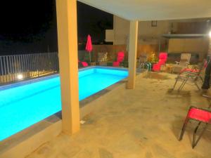 The swimming pool at or near Les Terrasses d'Erbalunga
