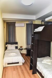 Postel nebo postele na pokoji v ubytování Gelati Tower