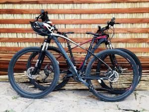 a bike is parked next to a wooden wall at Hostel Once Once in Villa de Leyva