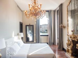 Postel nebo postele na pokoji v ubytování Palazzetto Foscari