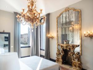 Postel nebo postele na pokoji v ubytování Palazzetto Foscari