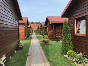 a row of houses with a walkway between them at Zielony Gaj in Wicie