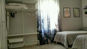 a room with a bedroom with a bed and a window at CasaDiPaola in Chieti